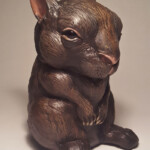 Carisa Swenson, “Little Critters, Big Problems (Endangered Species Chibi) - Amami Rabbit", Magic Sculpt, glass eyes, acrylic paints, wood, 8 inches h x 5 inches wide, $375 (Price for Set $950)