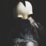 Mahlimae, "Echo V”, stone clay, feathers, hand blown glass, Australian merino wool, Icelandic wool, Cracticus tibicen mandible, 4.73 inches sitting height, $565