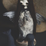 Mahlimae, "Echo VIII + Animal Familiars”, stone clay, hand blown glass, suri alpaca fibre, finch wings, Australian merino wool, hand dyed textiles, kyanite shard, Zosterops lateralis claw, hemp twine, 6.9 inches, $850 (Animal Familiars measure: Lupine - 3.15 (h) x 1.97 (l) inches, Lepus - 2.56 inches (h), Chamaeleo - 1.97 inches (l))