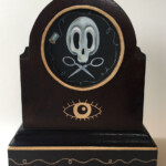 Gretchen Lewis, "Memento Mori”, oil on illustration board, mounted in hand-embellished antique wooden clock case, 5 x 5 image inches, entire piece is 8.25 x 10.25 x 5, $475
